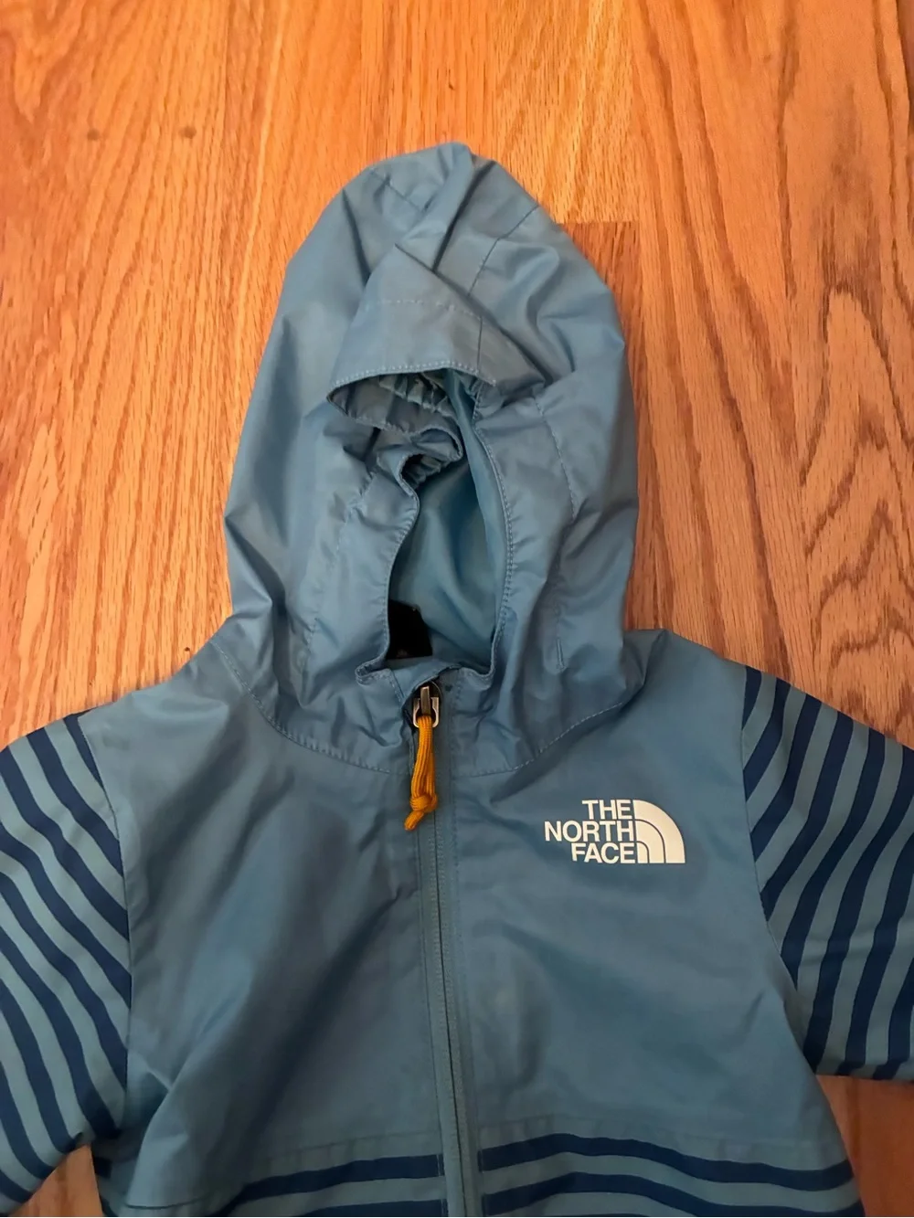 The North Face Infant ZIPLINE RAIN JACKET NIAGARA BLUE MINI STRIPE PRINT 6-12 mo